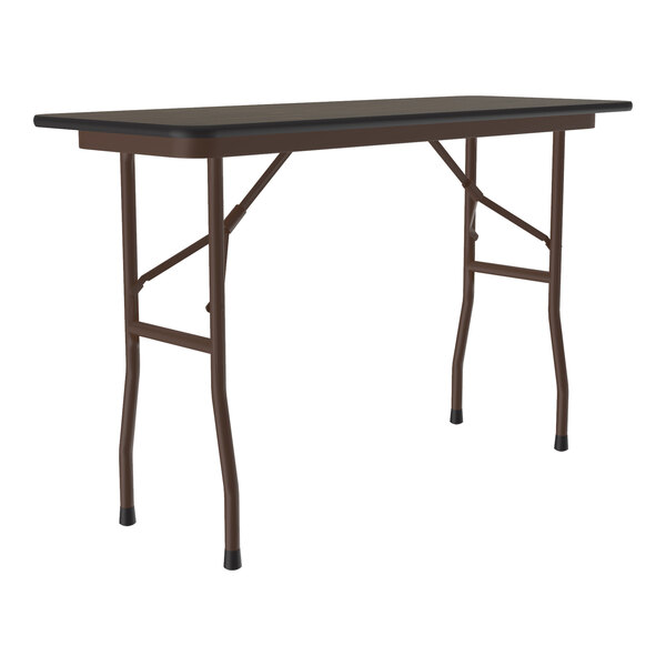 A rectangular walnut-colored folding table with metal legs and a melamine top.