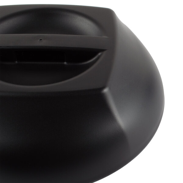 A black rectangular plastic lid with a black border and a hole in the center.