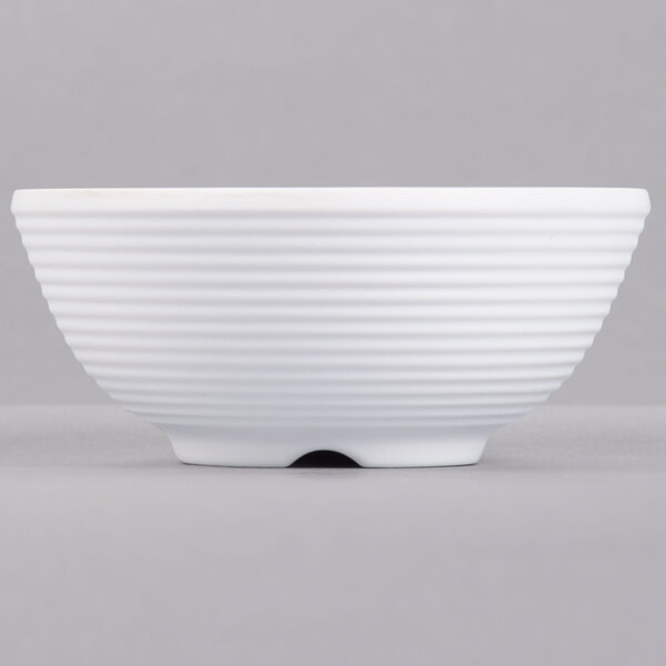 A white Tablecraft melamine ramekin with ribbed sides.