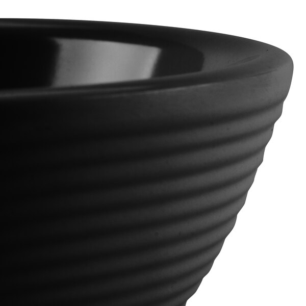 A black Tablecraft melamine ramekin with a ribbed design.