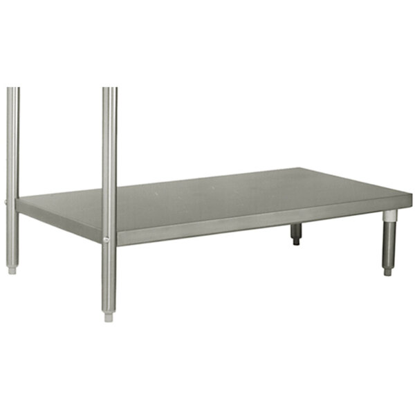 a grey rectangular object with metal legs