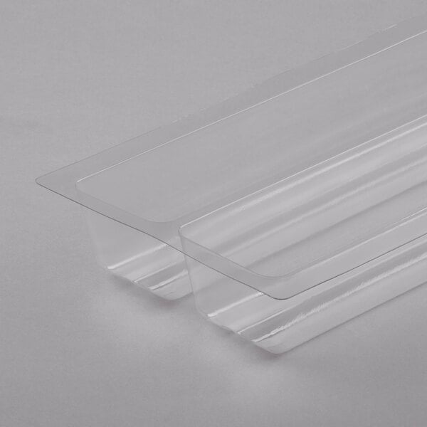 Two clear plastic trays with handles.