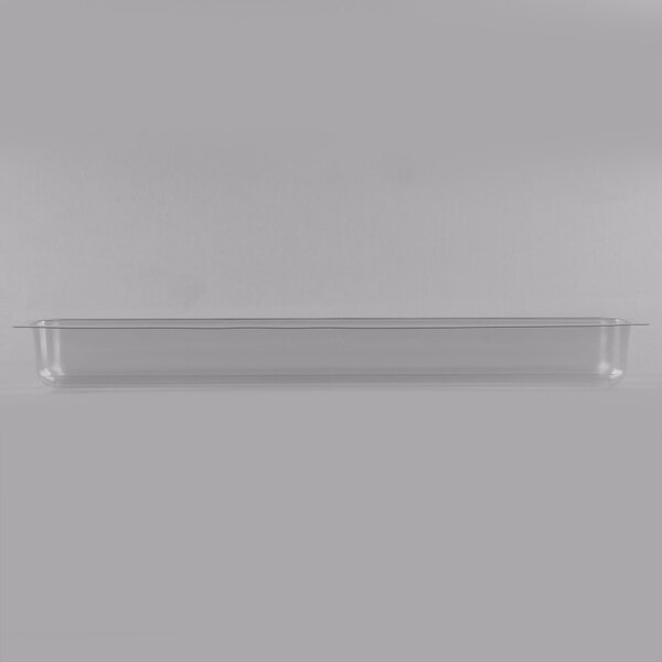 A clear plastic container with a white rectangular Matfer Buche cake mold inside.