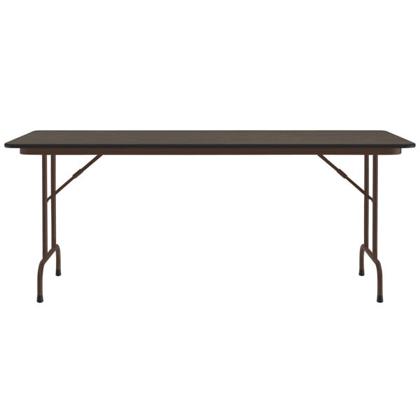 A Correll rectangular walnut folding table with legs and a black top.