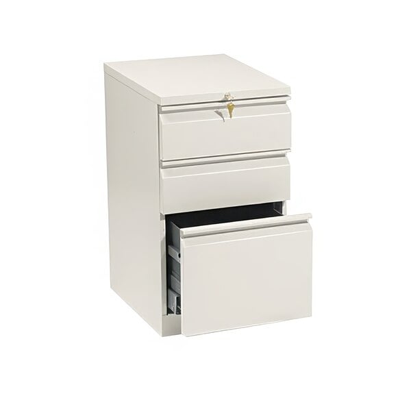 A putty HON three-drawer mobile pedestal filing cabinet with a lock.