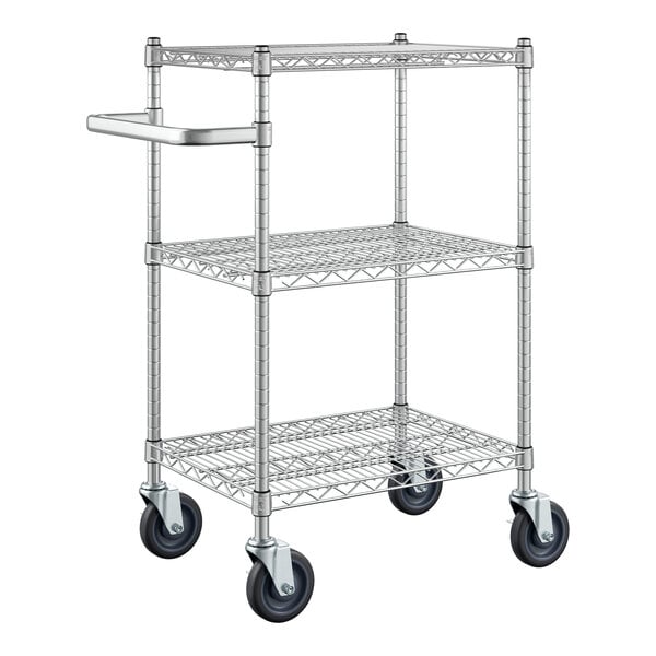 A silver metal Regency utility cart with three wire shelves and black wheels.