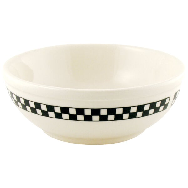 a white bowl with black and white checkered design