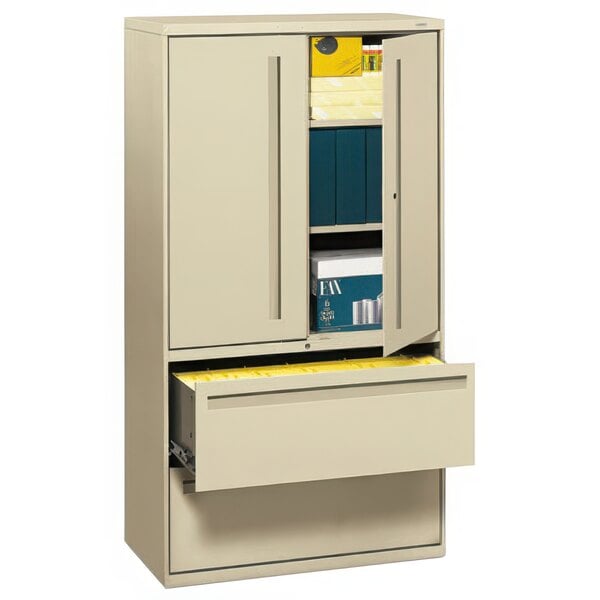 A HON putty filing cabinet with two lateral drawers.