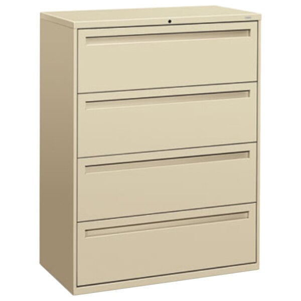 A tan HON 700 Series lateral filing cabinet with four drawers.