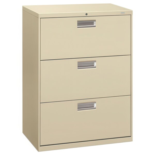 A tan HON 600 Series lateral filing cabinet with three drawers.