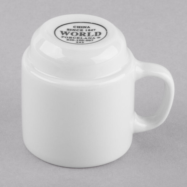 A white Libbey porcelain espresso cup with a handle.