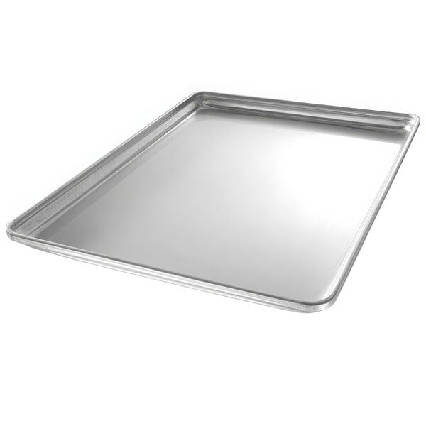 A Chicago Metallic full size aluminum sheet pan with a band in rim on a counter.