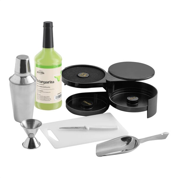 A 7-piece margarita starter kit including a bottle of margarita mix, cocktail shaker, jigger, cutting board, knife, ice scoop, and a salt rimmer.