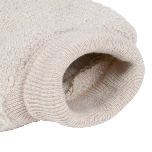 A close-up of a pair of beige knitted gloves with a white tag.