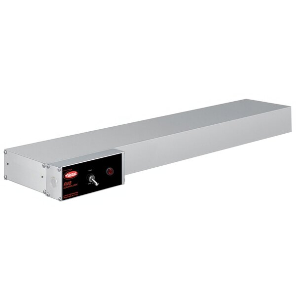 A stainless steel rectangular shelf with a red light and a rectangular button.