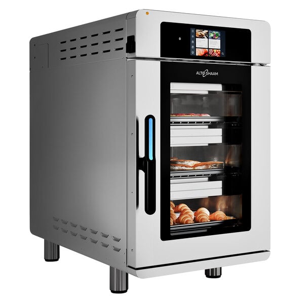 A stainless steel Alto-Shaam Vector H Series multi-cook oven with food inside.