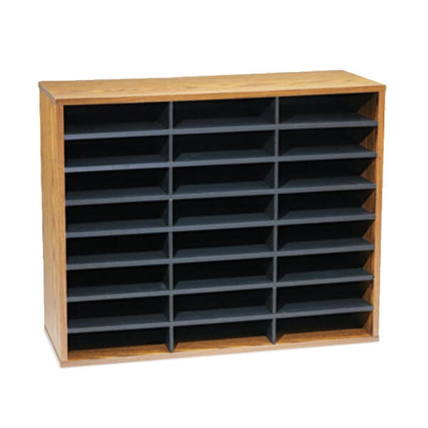 A Fellowes medium oak literature organizer with black shelves on a wooden shelf.