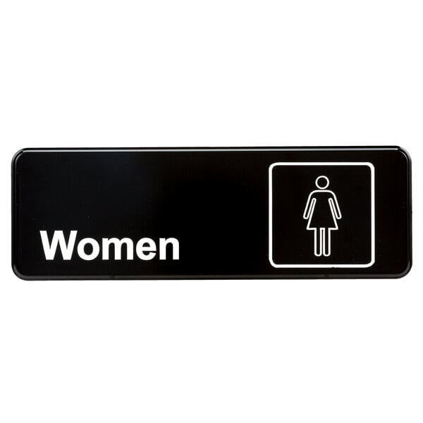 A black rectangular sign with white text that says "Women" and features a white woman symbol.