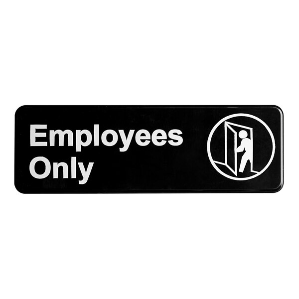 A black and white sign that says "Employees Only" in white letters.