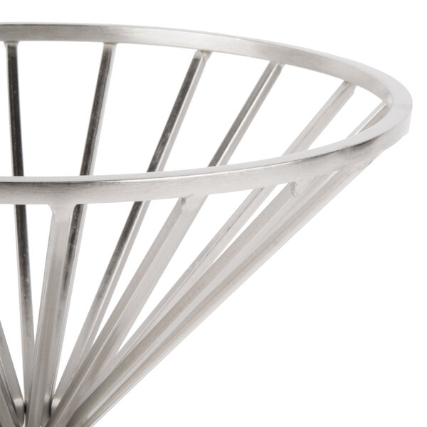 A Clipper Mill chrome plated iron wire basket with a base on a table.