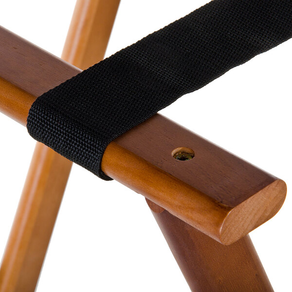 A black strap on an American Metalcraft walnut wood tray stand frame.