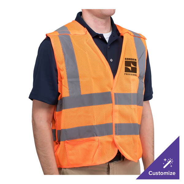 A person wearing a Cordova orange high visibility safety vest with customizable features.