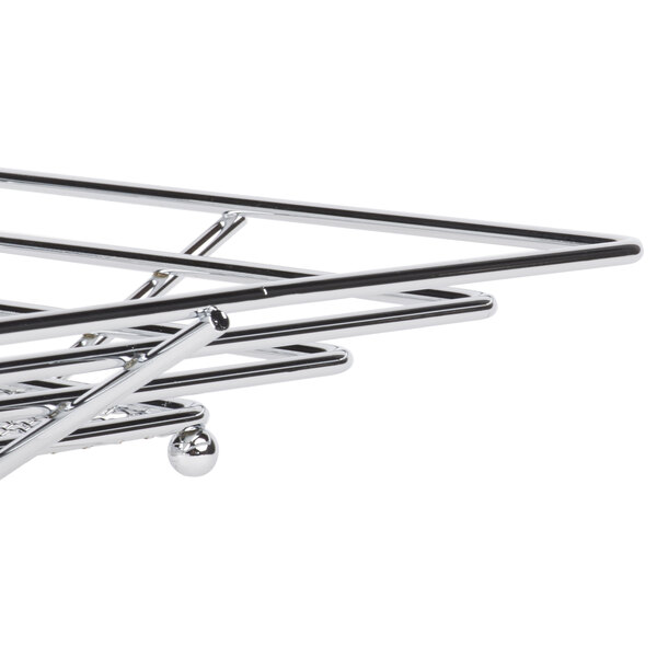 A Clipper Mill chrome plated iron square wire basket on a metal rack.