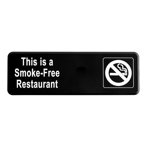A black Vollrath Traex smoke-free restaurant sign with white text.