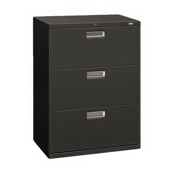 A charcoal HON three-drawer lateral filing cabinet with silver handles.