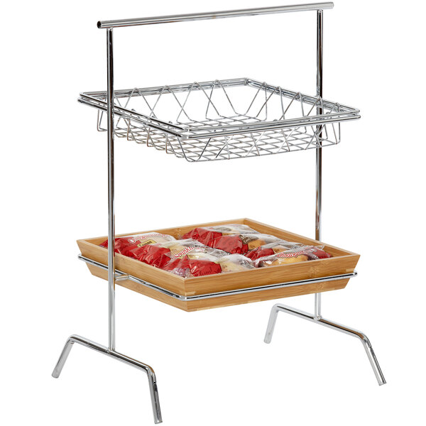A Clipper Mill chrome plated iron square wire basket on a metal rack with food in it.