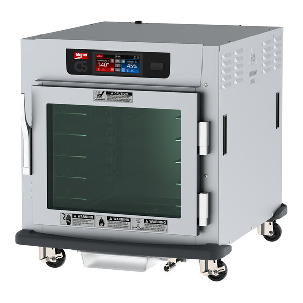 A Metro C5 9 Series undercounter heated holding and proofing cabinet with a clear glass door on wheels.