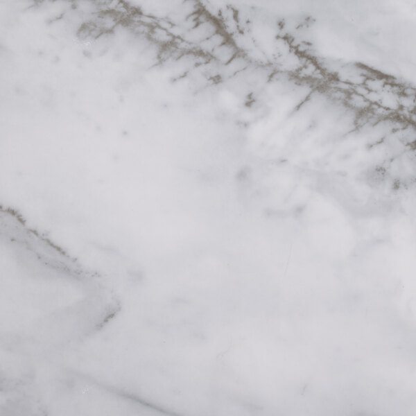 A close-up of a white marbled surface on a serving board.