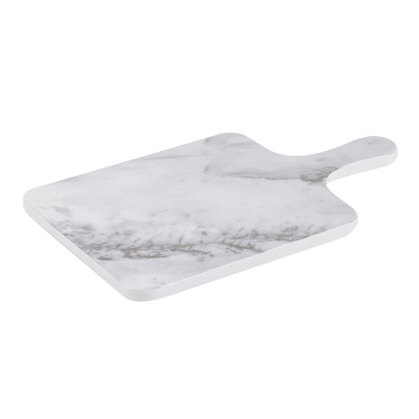 A white marble Thunder Group serving board with handle.