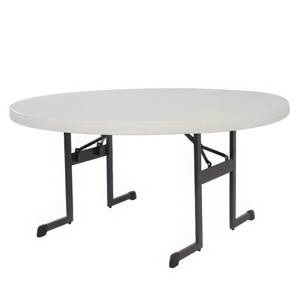 A white round Lifetime folding table with black legs.