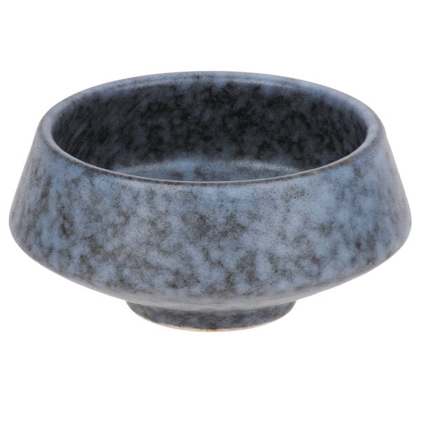 A close-up of a blue Biseki stoneware bowl with a black and gray design.
