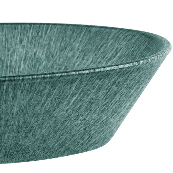 A green polyethylene oval basket on a table in a salad bar.