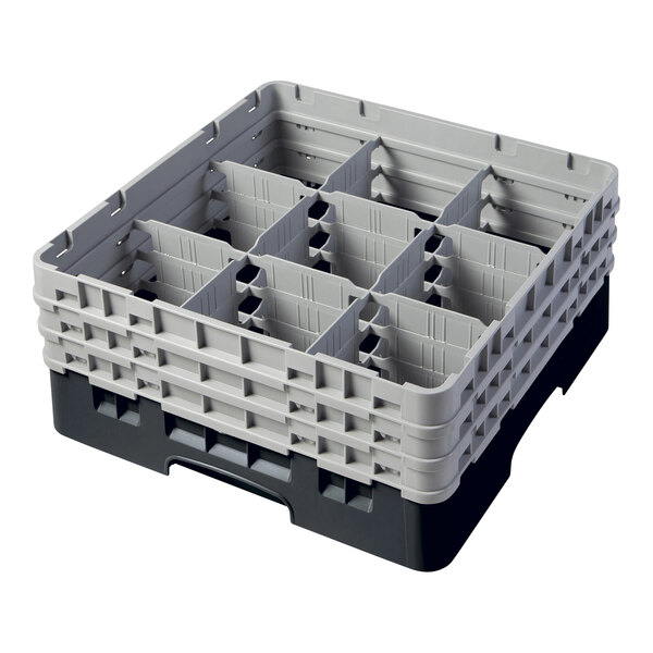 A black plastic Camrack with 9 compartments and 3 extenders with holes.