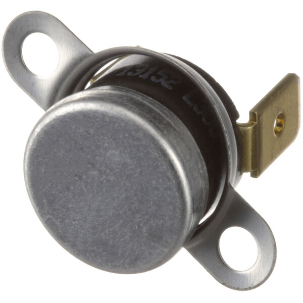 A close-up of an Amana Cavity Thermal Switch, a small metal device with a metal plate.