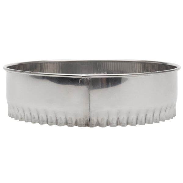 A stainless steel fluted round cutter with a white background.