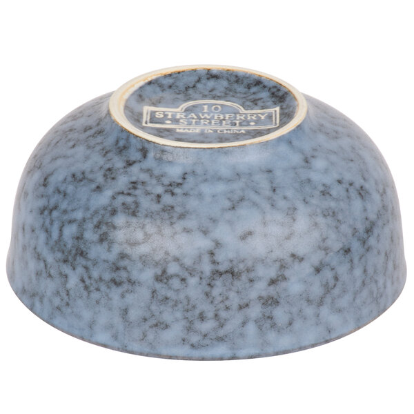 A blue stoneware bowl with a white and blue logo on it.