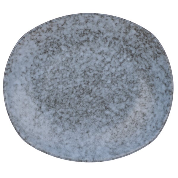 A rectangular blue stoneware dinner plate with a speckled design.