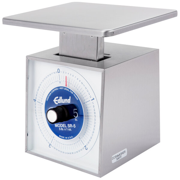 A silver Edlund mechanical portion scale with a blue dial.
