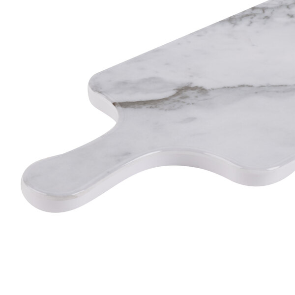A white marble Thunder Group melamine serving board with a handle.