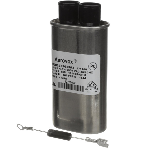 A silver Amana capacitor with black and silver caps.