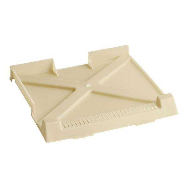 A white plastic Amana grease shield with x-shaped holes and two handles.