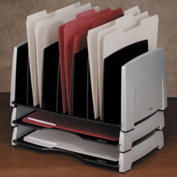 A close-up of a Fellowes black and silver side load plastic tray holding several folders on a desk.