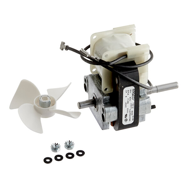 A Traulsen blower motor with a white propeller and screws.
