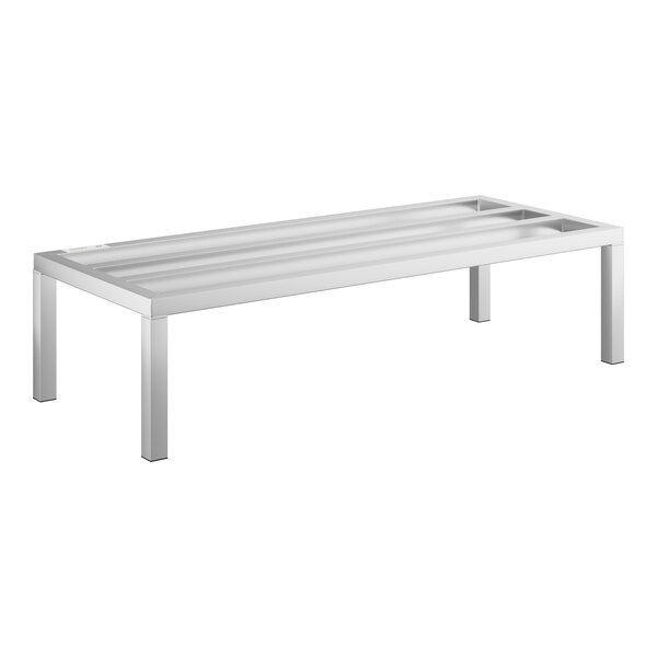 A long white rectangular Regency aluminum dunnage rack on metal legs.