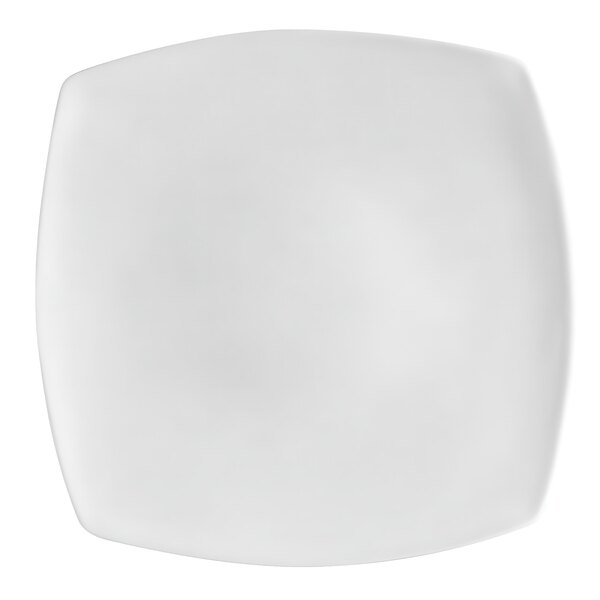 A close up of a CAC white square plate with a white rim.