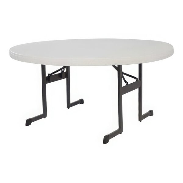 A white round Lifetime plastic folding table with black legs.